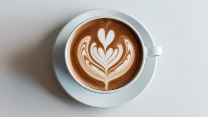 A coffee cup on a brown wooden table with cappuccino foam and heart art