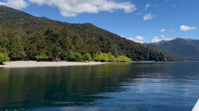Lago Lacar Quila Quina in Argentina, showcasing calm waters, lush greenery, and mountains