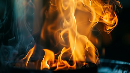 Vibrant Orange Flames Rising Against A Dark Smoky Backdrop