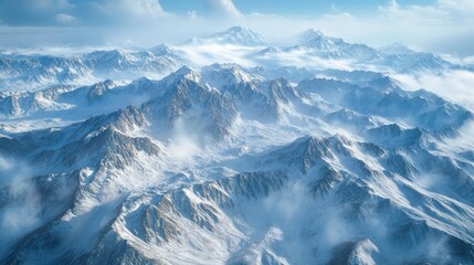 Obraz premium Majestic snow-covered mountain range with ethereal fog creating a tranquil vista