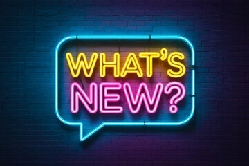 Colorful neon sign reading 'WHAT'S NEW?' against a dark background.