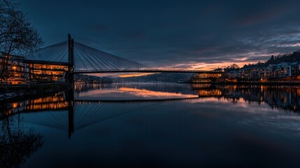 Obraz premium A scenic bridge spanning tranquil waters at the dusky blue hour