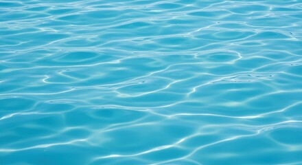 Blue water surface with sunlight reflections