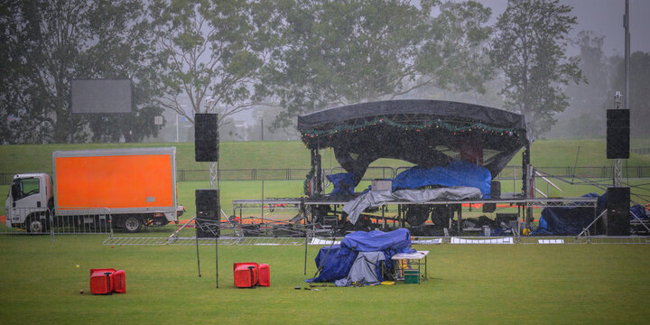 A concert stage is destroyed during a wild storm