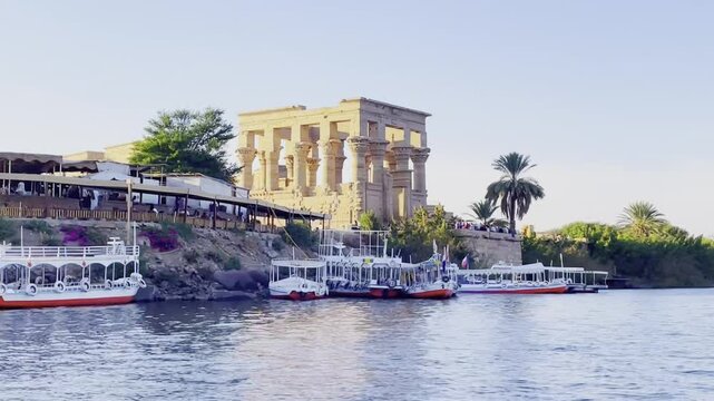 Philae Temple and Tourist Boats on the Nile River in Aswan, Egypt