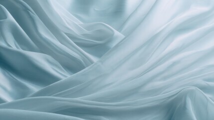 Obraz premium Soft Light Blue Silk Fabric with Gentle Folds and Diffused Texture