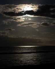 Dramatic Ocean View Under a Cloudy Sky with Light Reflections