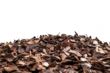 Pile of brown bark mulch for gardening isolated on transparent background