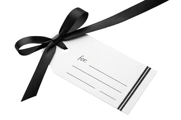 A blank paper card and gift tag, both tied with a red ribbon, suggest a holiday greeting or a present with a message