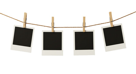 Four Blank Instant Photos Hanging on Twine with Wooden Clothespins