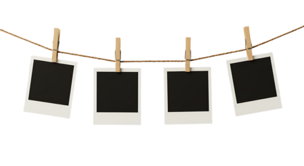 Four Blank Instant Photos Hanging on Twine with Wooden Clothespins