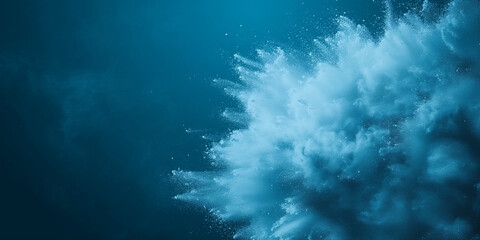 Naklejka premium Abstract blue cloud bursting with powder against a deep teal backdrop