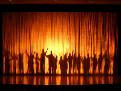 children are making shadow puppets using ohp film.