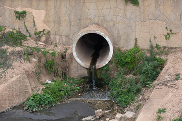 Pollution discharge outlet of large concrete pipe in the city