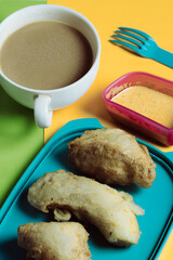 Crispy Fried Snacks with Dipping Sauce on Colorful Background