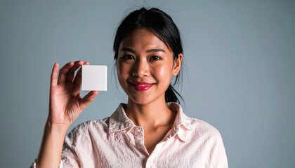 Showcasing a product by a young woman studio portrait professional environment eye-level view marketing concept