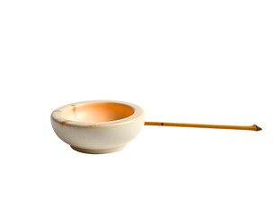 A traditional Japanese tea bowl and chashaku dipper.