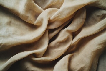Fototapeta premium Soft, flowing light beige fabric draped in folds