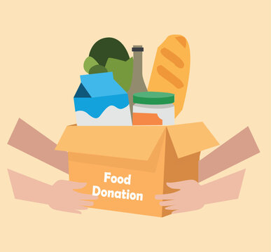 Donation food box in hands of volunteer. Food Bank with canned non perishable foods.