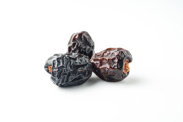 Dates fruit ajwa or kurma ajwa, isolated on white background