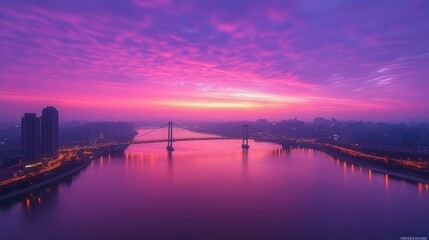 Obraz premium Vibrant sunrise over city and river