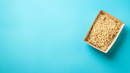 Takeout Box of Plain Noodles on Vibrant Blue Background for Minimalist Food Concept