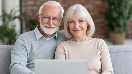 Fototapeta premium Senior Couple Using Laptop at Home Smiling Together