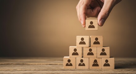 Photo of Hand Building Human Resource Pyramid With Wooden Blocks