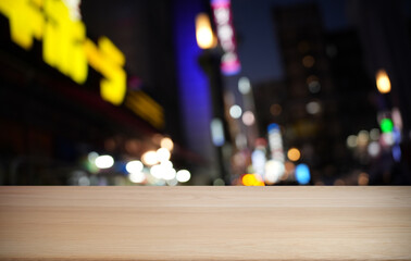 Empty wood table top and blur of restaurant background selective focus product display