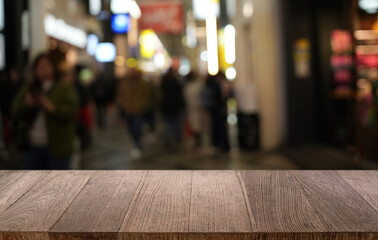 Empty wood table top and blur of restaurant background selective focus product display
