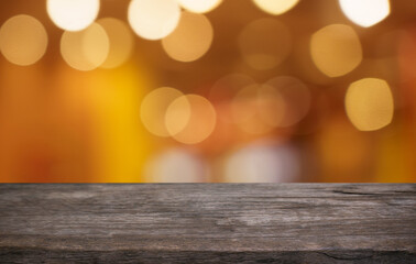 Empty wood table top and blur of restaurant background selective focus product display