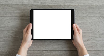 Photo of Hands Holding Blank Screen Tablet on Gray Wood Table