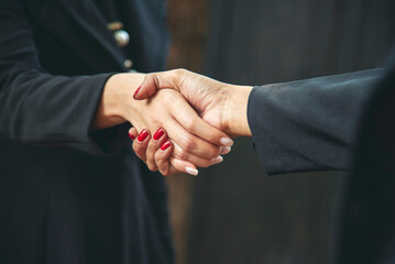 Team Business Partners shaking hands together to Greeting Start up small business in meeting room....