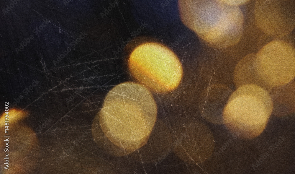 Poster golden sparkles with soft bokeh lights against a dark background. the left-aligned composition leave