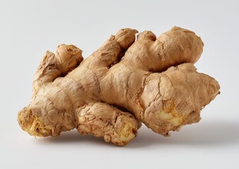 Close-up of fresh ginger root on white background.