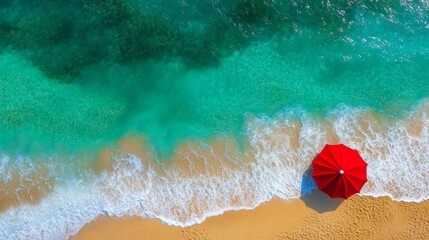 Fototapeta premium Tropical beach aerial view with turquoise ocean water and a red beach umbrella for summer vacation concept