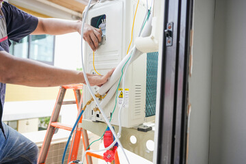 Air conditioning technicians install new air conditioners, Repairman fix air conditioning systems, Technician service for repair and maintenance of air conditioners