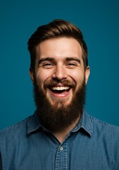 Obraz premium Photo Portrait of a Bearded Man Laughing on Blue Background