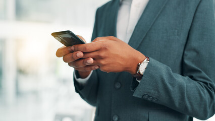 Business person, hands and typing with phone for communication, texting or online chatting at office. Closeup, employee or user with mobile smartphone for social media, research or app at workplace