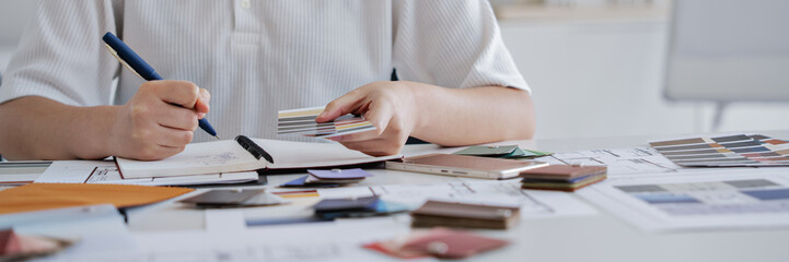 Interior architect working with blueprint planning in modern office, engineering concept