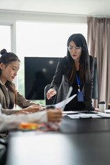 Business team discuss and collaborating on project during meeting