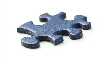 Fototapeta premium A single jigsaw puzzle piece rests on a plain white background.