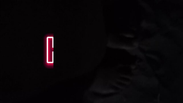 Red Neon Letter C Glowing on Black Background