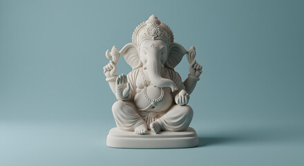 Serene Ganesha Statue:  White Marble Sculpture on Blue Background