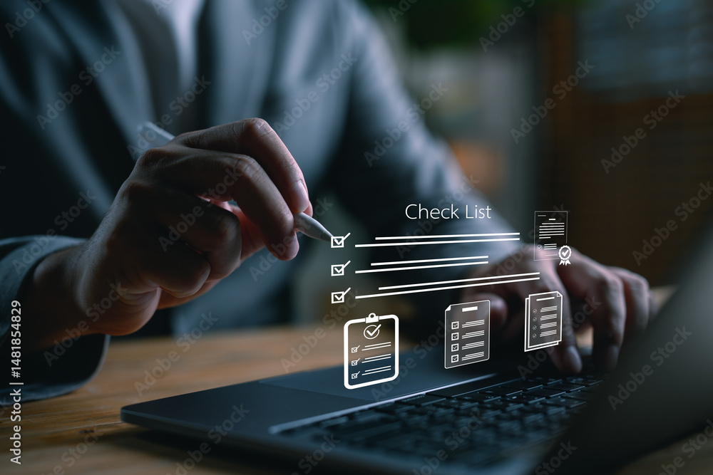 Poster Close-up of hand using stylus on laptop with digital checklist interface. Concept of productivity, task management, business planning, digital workflow, and project organization.