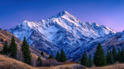 Obraz premium Majestic Snow Capped Mountain Peak at Sunrise