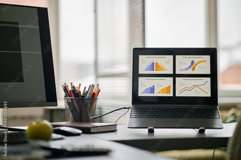 Poster modern office desk with laptop showing graphs and charts discussing statistical data with pens, book