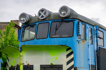 Cab of a blue diesel snowplow locomotive with distinctive roof-mounted headlights and a...