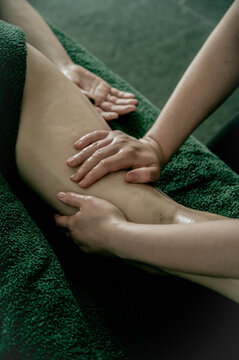 Massagist's hands making anti-cellulite massage