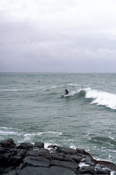 Man surfs the ocean waves in Australia